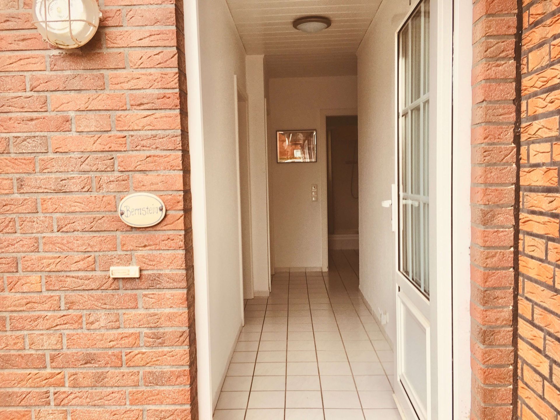 Ferienwohnung Bernstein im Haus Aquamarin in Büsum – Privater Eingang im Erdgeschoss