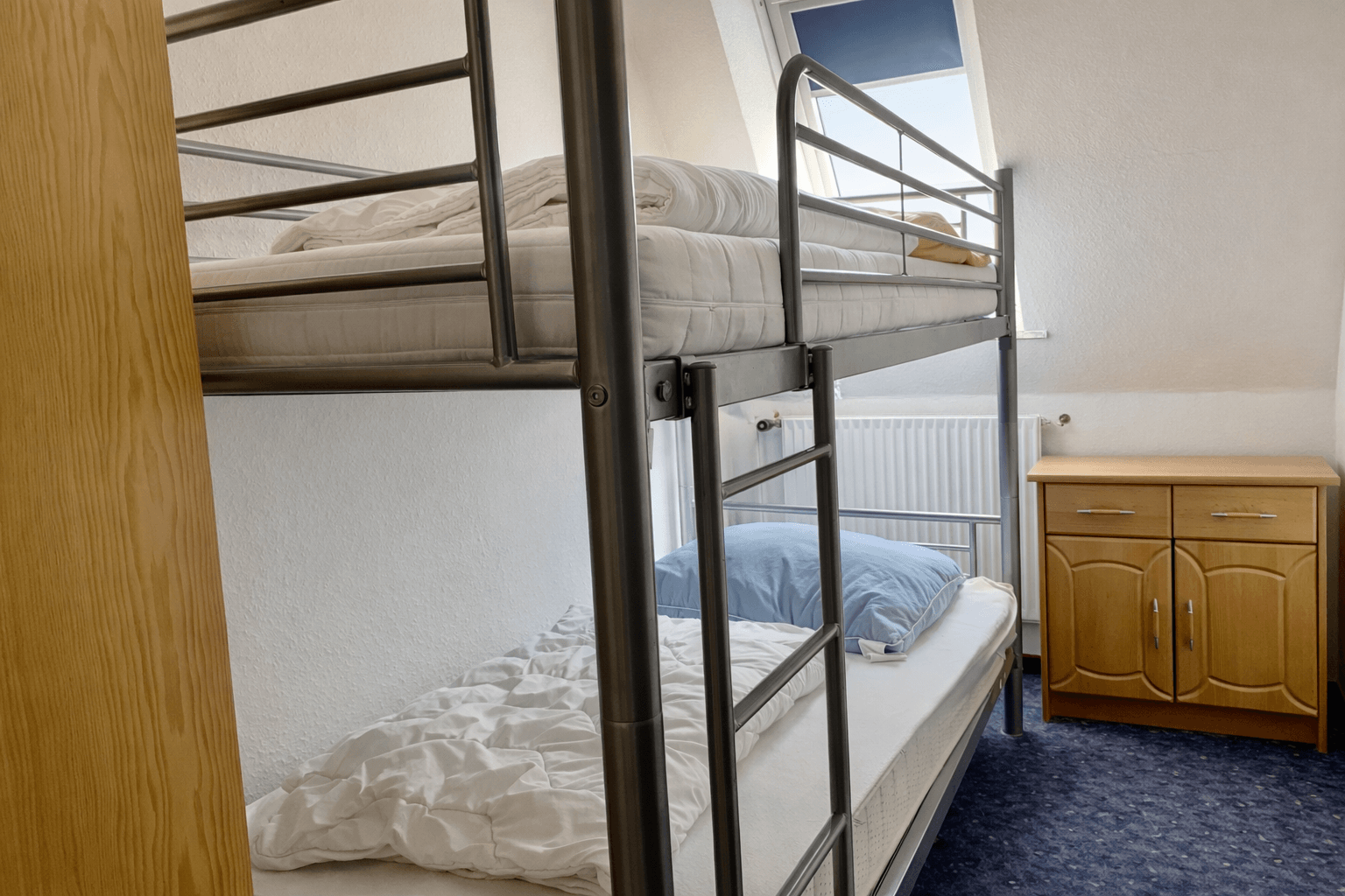 Ferienwohnung Opal im Haus Aquamarin in Büsum – Zweites Schlafzimmer mit Etagenbett