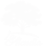 Logotipo blanco de un árbol con las palabras «La Alcudia» sobre un fondo negro