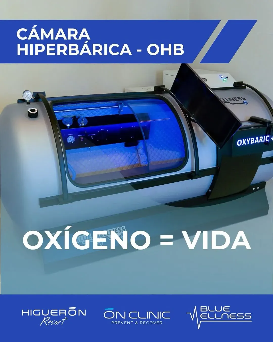 Cámara hiperbárica, color blanco y azul, con texto “OXÍGENO = VIDA”.