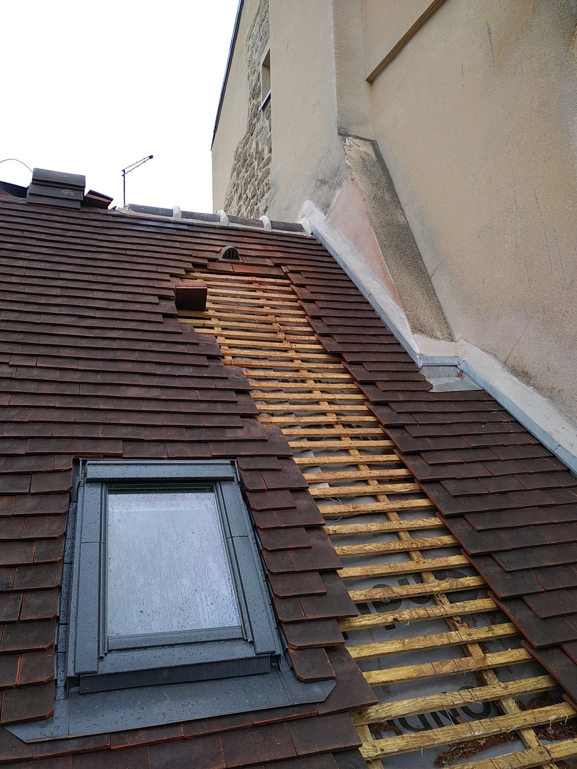 Changement de tuiles plates sur une toiture