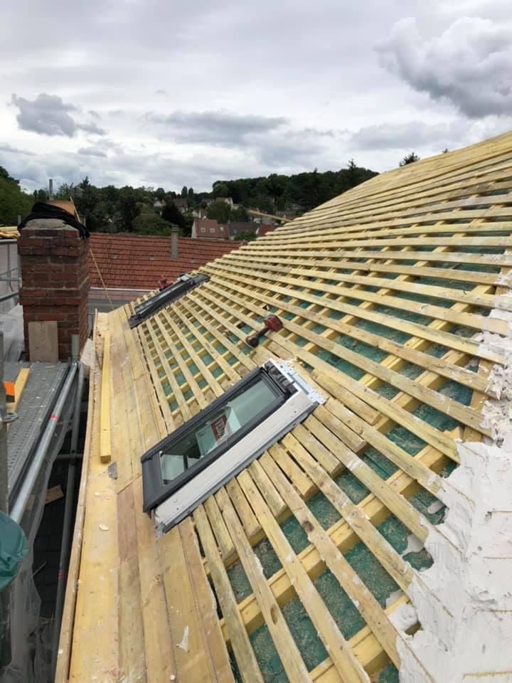 Pose de la novuelle toiture et des fenêtres de toit
