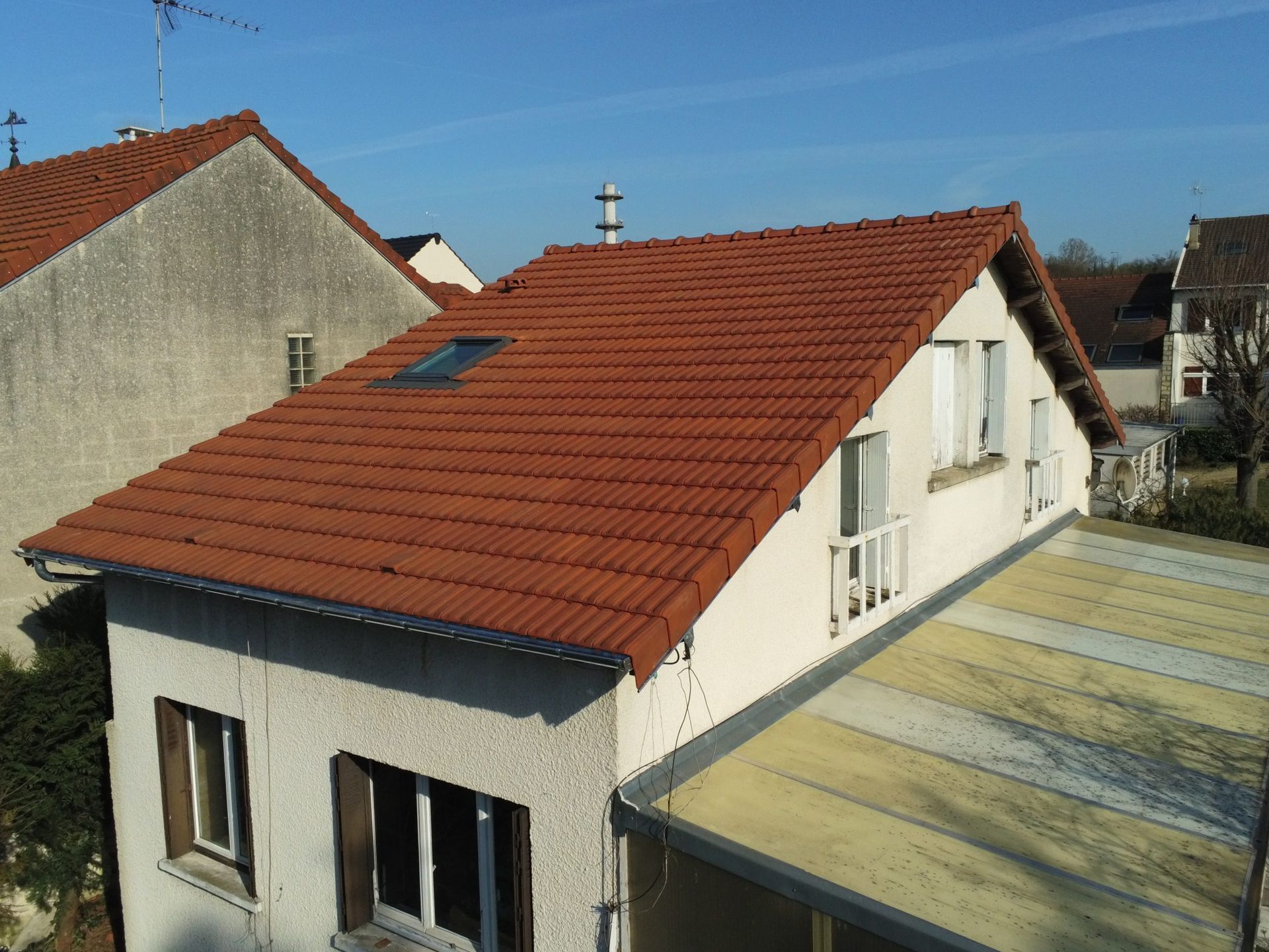 Maison en tuile avec véranda