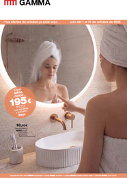 Tocador de baño en una habitación de color beige claro con espejo redondo, mueble de madera oscura, lavabo y planta en maceta.