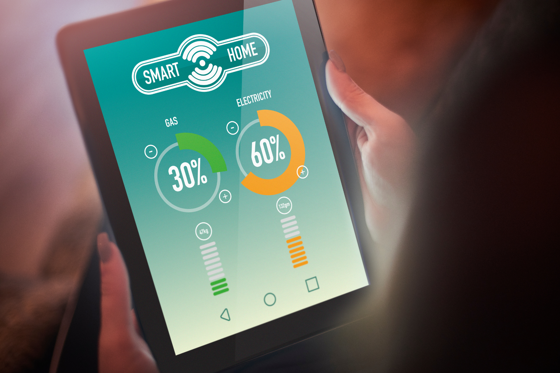 Personne utilisant une tablette affichant des graphiques circulaires verts et oranges.