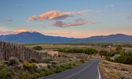Open road through the vast landscape of New Mexico