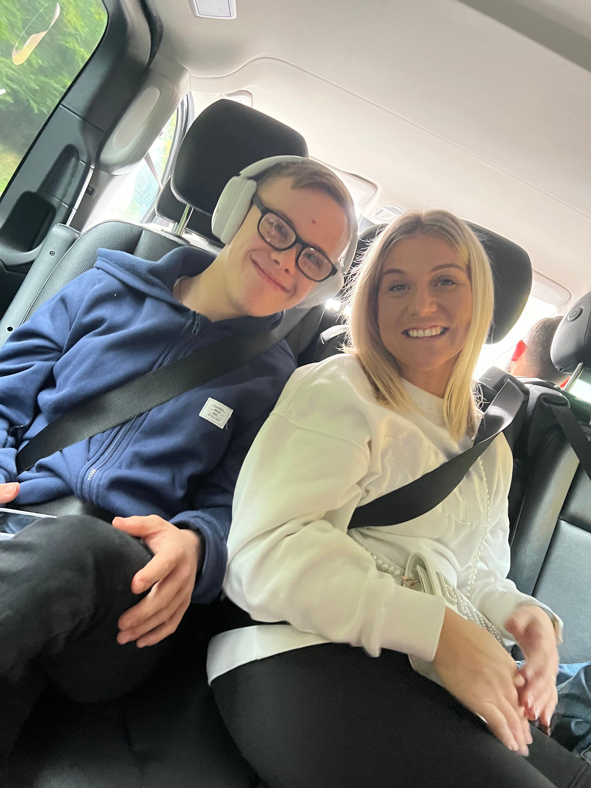 Charlotte and her brother on a transfer to the airport