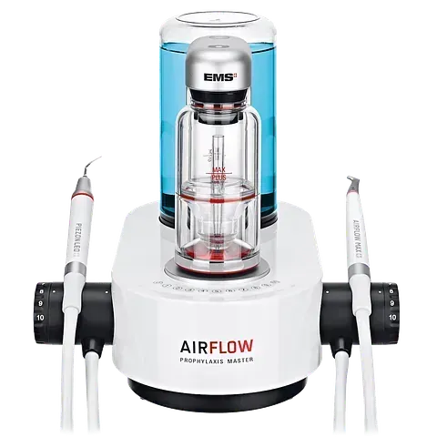 Una máquina dental con una botella de agua encima.