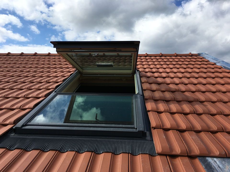 Fenêtre de toit Velux sur un toit classique