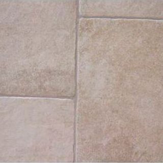 Un primer plano de un suelo de baldosas beige.
