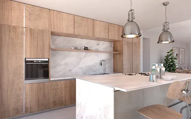 Una cocina con gabinetes de madera y una encimera blanca.