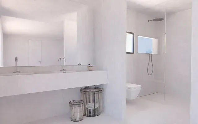 Un baño con dos lavabos, un inodoro y una ducha.