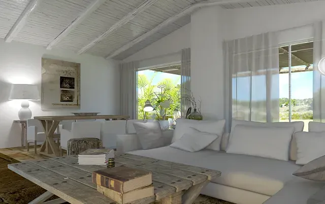 Una sala de estar con sofá, mesa, sillas y una gran ventana.