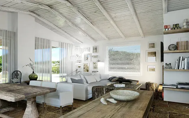 Una sala de estar con sofá, mesa y sillas.