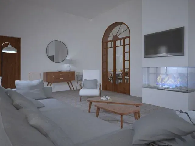 Una sala de estar con chimenea y un sofá.