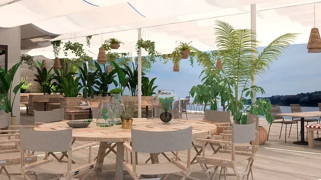 Un restaurante con mesas y sillas y vista al mar.