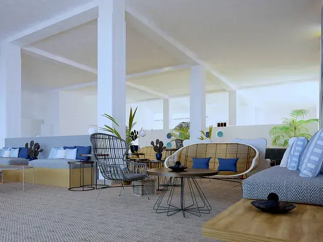 Una sala de estar con muchos muebles y mesas.