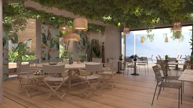 Un restaurante con mesas y sillas y vista al mar.