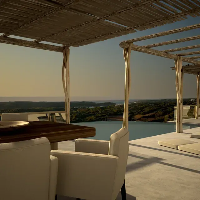 Una mesa y sillas debajo de una pérgola con vista a una piscina.