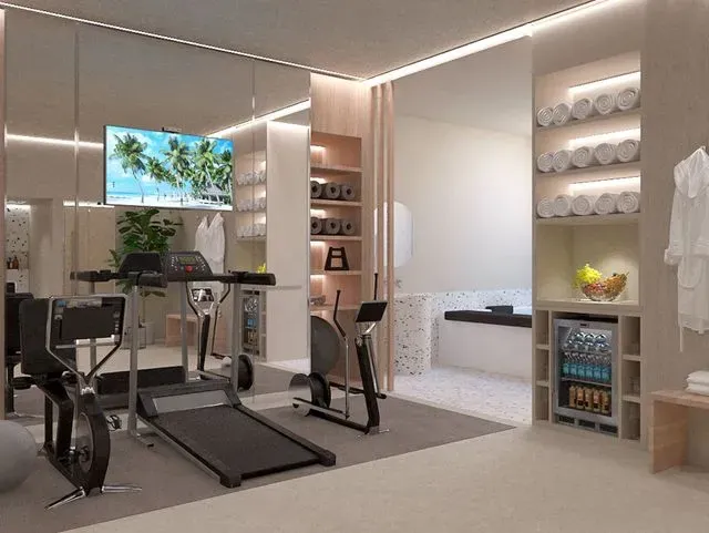 Una impresión artística de un gimnasio en casa con una cinta de correr, una bicicleta estática y un televisor.