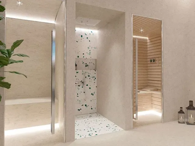 Un baño con ducha a ras de suelo y bañera.