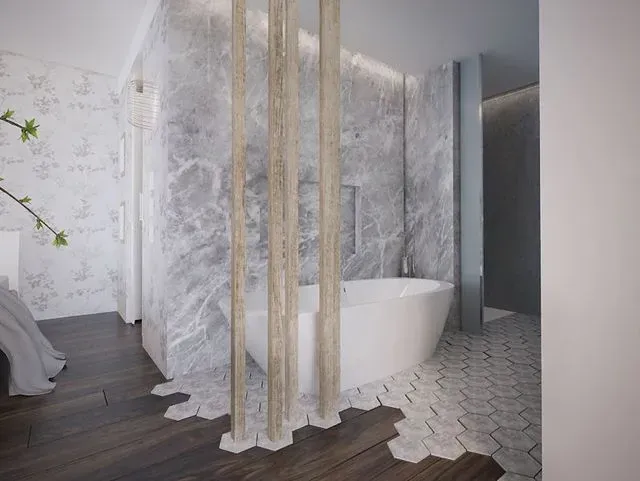 Un baño con bañera y pared de madera.