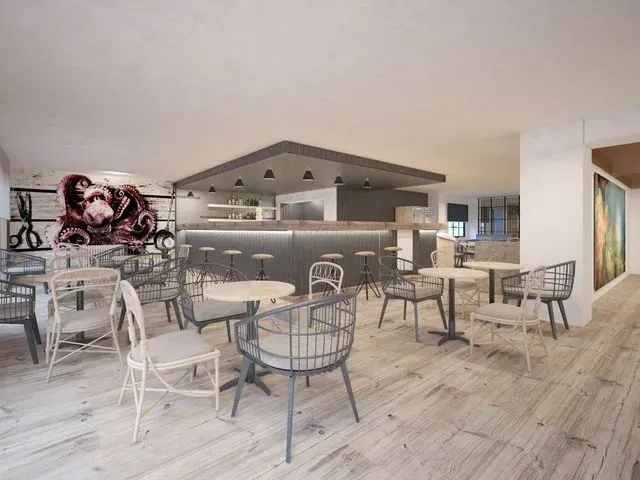 Una impresión artística de un restaurante con mesas y sillas.