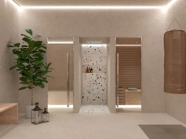 Un baño con una planta y faroles.