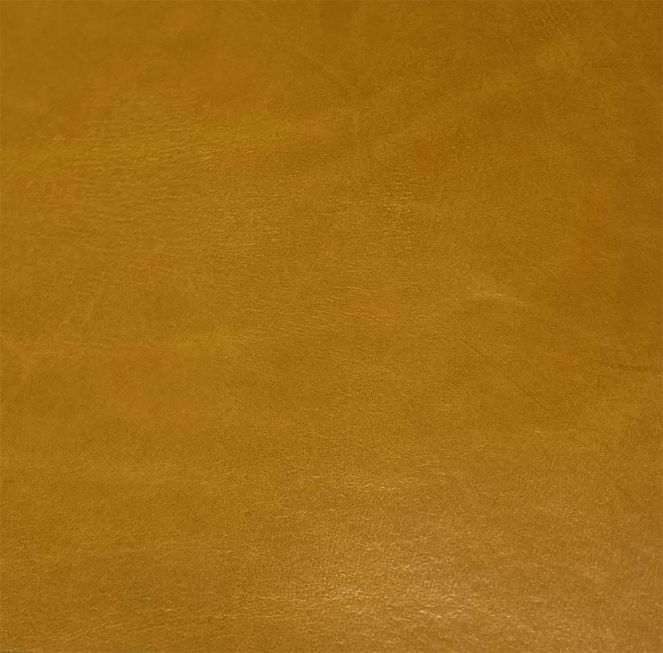 Superficie marrón con textura de canela y sutiles variaciones de tono.