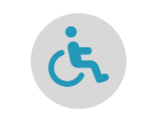 Símbolo de silla de ruedas azul en un círculo gris, que indica accesibilidad.