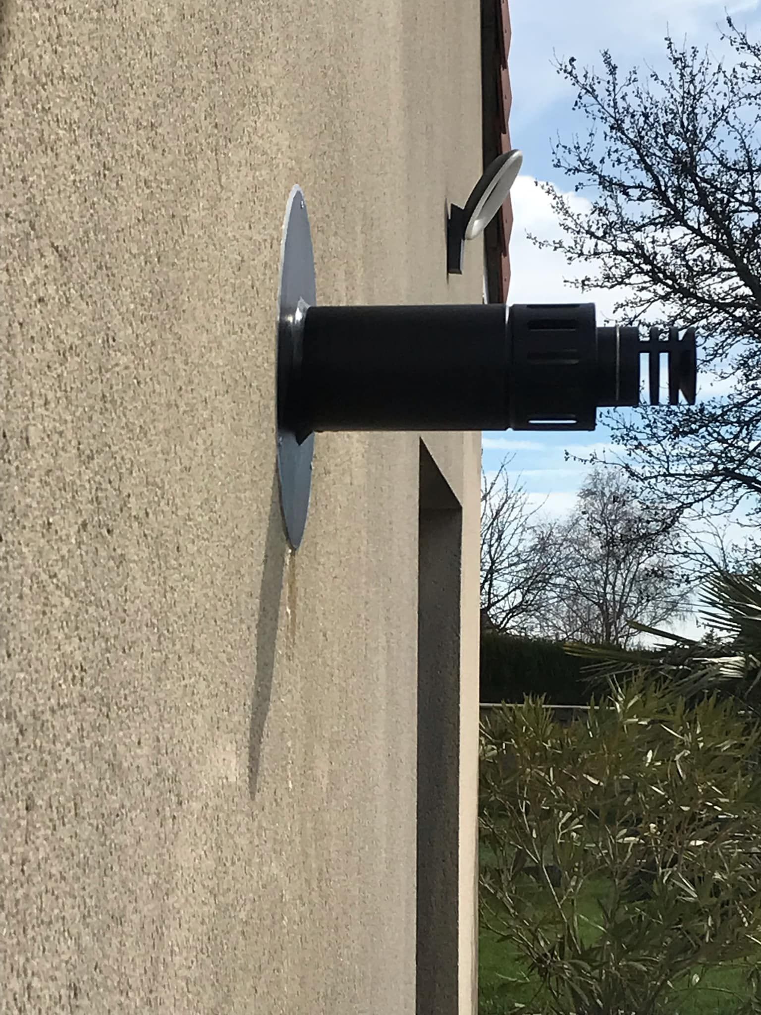 Sortie de poêle d'un mur extérieur