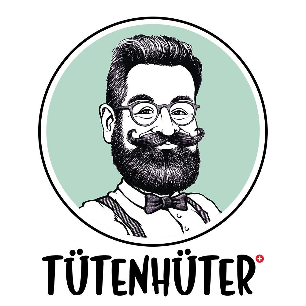 Ein Mann mit Bart und Brille trägt Hosenträger und eine Fliege.