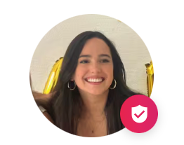 Smiling woman in a circular profile photo, with a pink verification badge in the lower right.