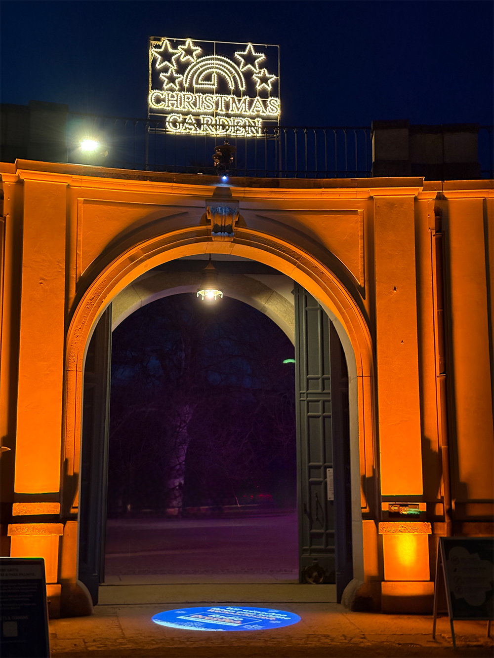 Illuminated archway entrance at night with