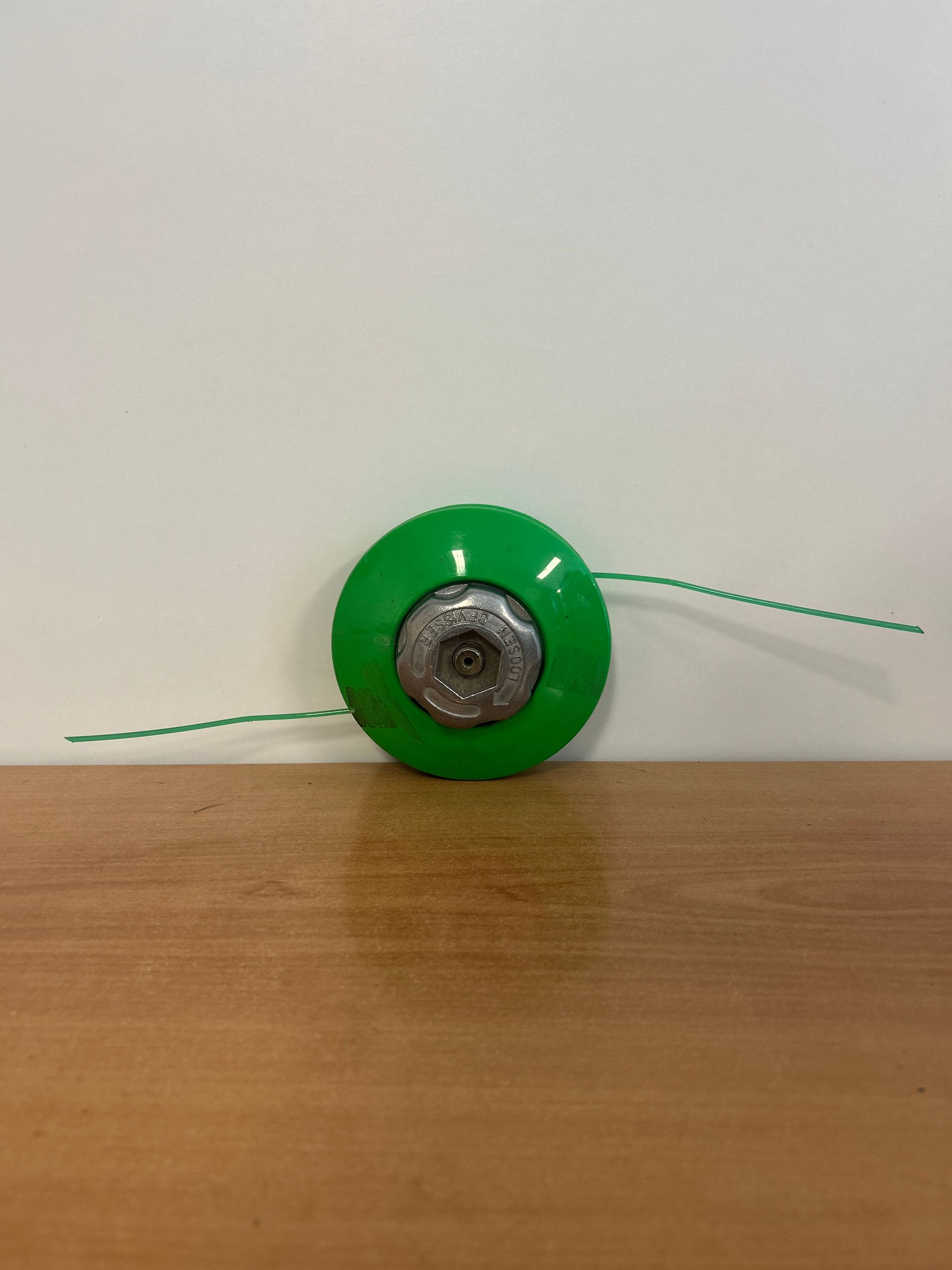 Tête débroussailleuse verte