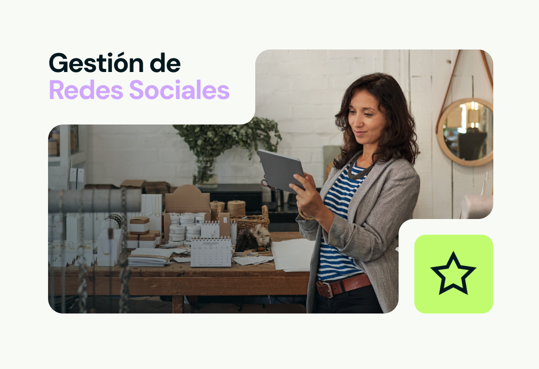 Una mujer está parada frente a una mesa sosteniendo una tableta.