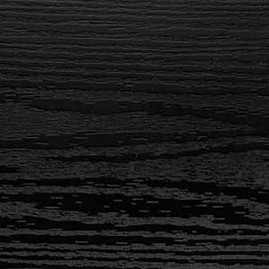 A close up of a black wood grain texture.