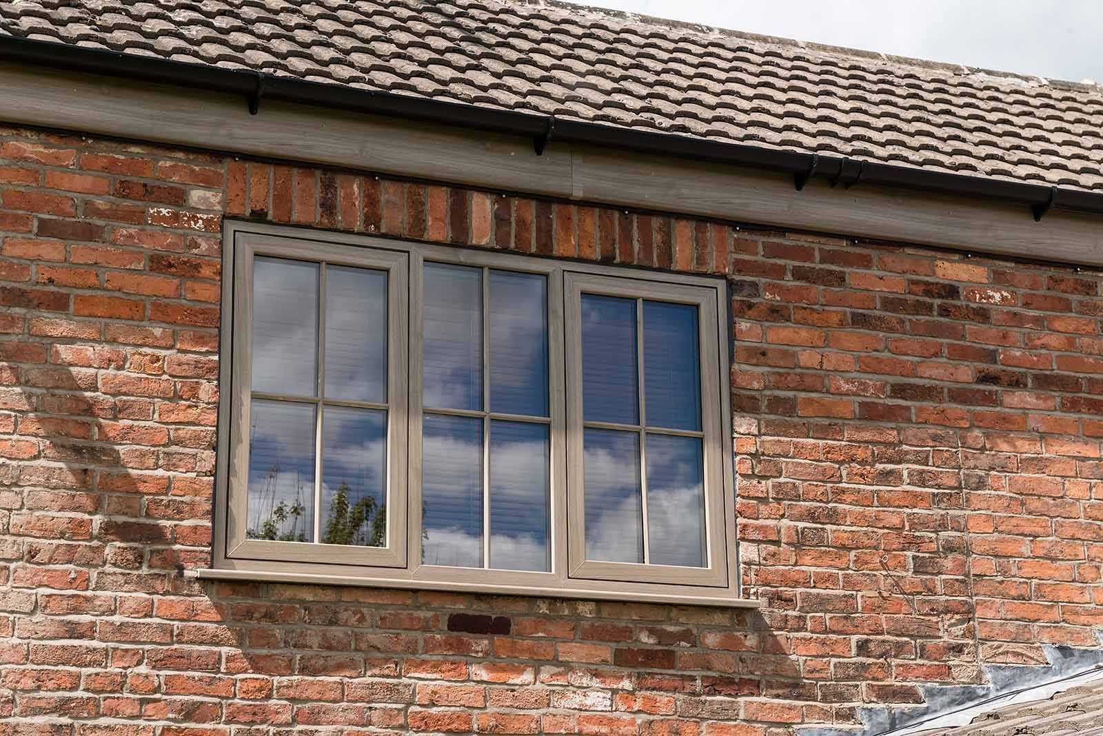 A brick building with a window on the side of it.