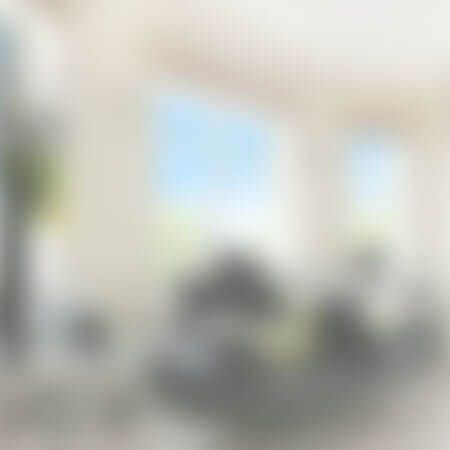 A blurry picture of a room with a lot of windows.
