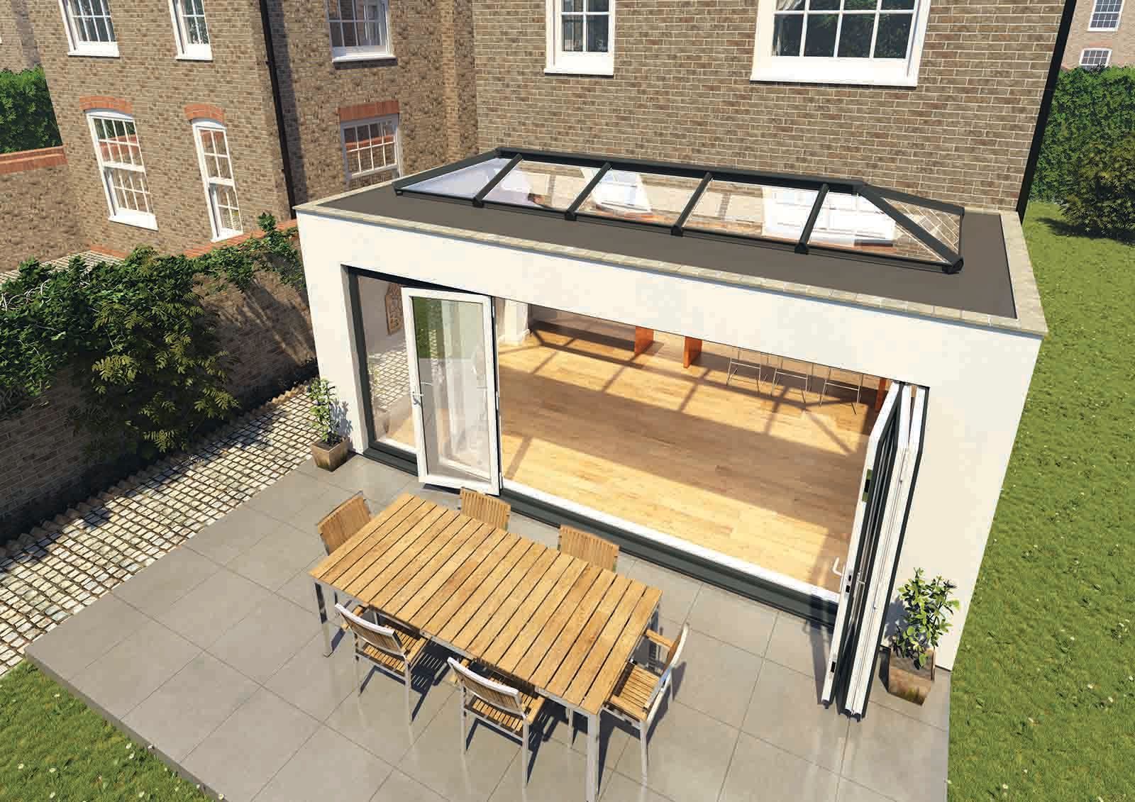 An aerial view of a house with a table and chairs on the patio.