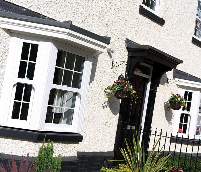 A house with a black door and white windows