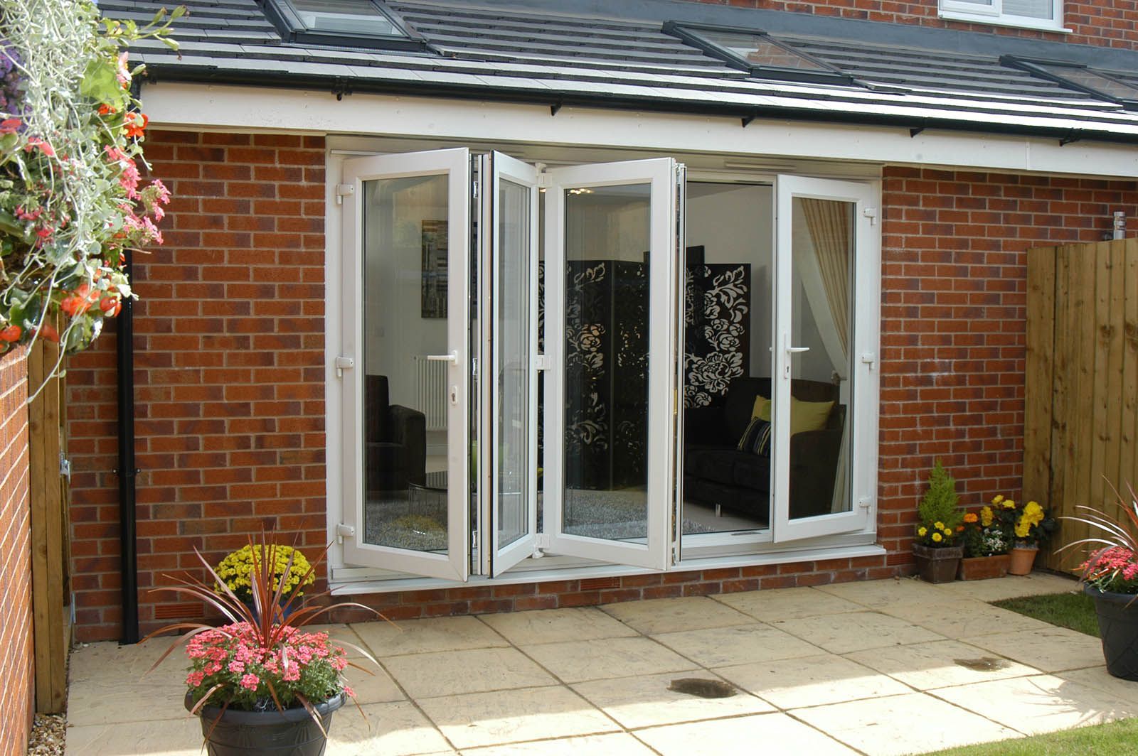 A brick house with a patio and sliding glass doors