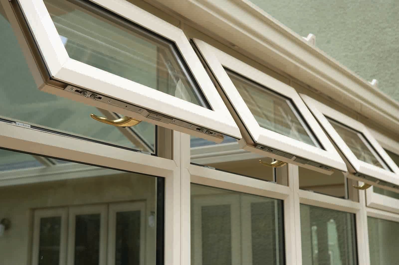 A row of windows with the top one open