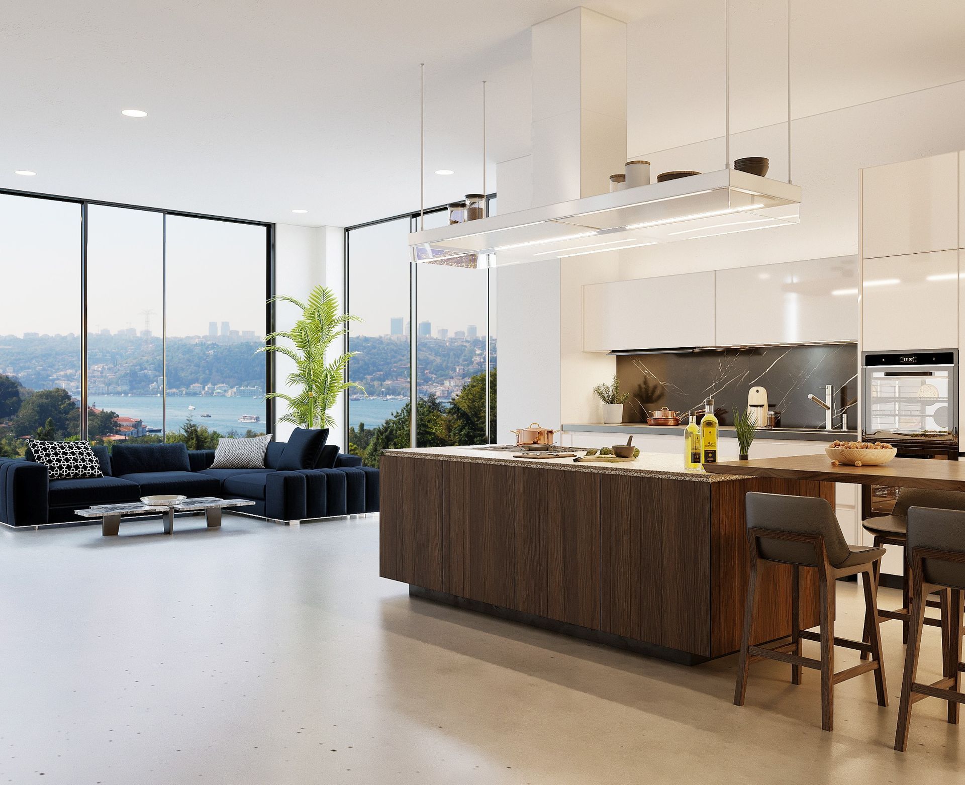 Una sala de estar con un sofá y una cocina con una gran isla.