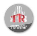 El logotipo de construcciones e interiorismo es un círculo con un edificio encima.