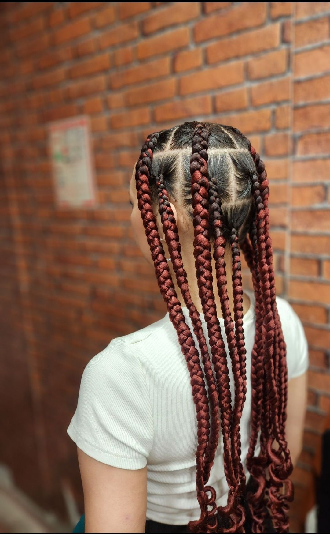 Tresses africaines avec mèches rouge cuivrées