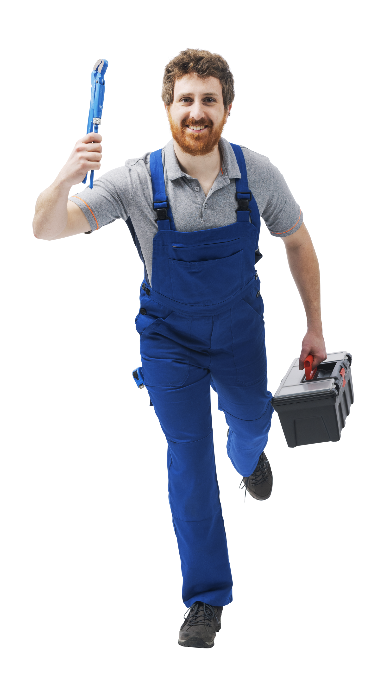 Un ouvrier souriant, vêtu d'une salopette bleue et d'une chemise grise, court vers l'avant, tenant une clé à pipe en l'air et une boîte à outils en bas.