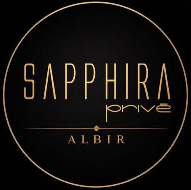 Black circular logo with gold text reading &ldquo;SAPPHIRA prime ALBIR.&rdquo;