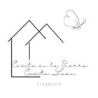 Un logotipo en blanco y negro para una casa con una mariposa encima.