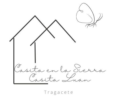 Un logotipo en blanco y negro para una casa con una mariposa encima.